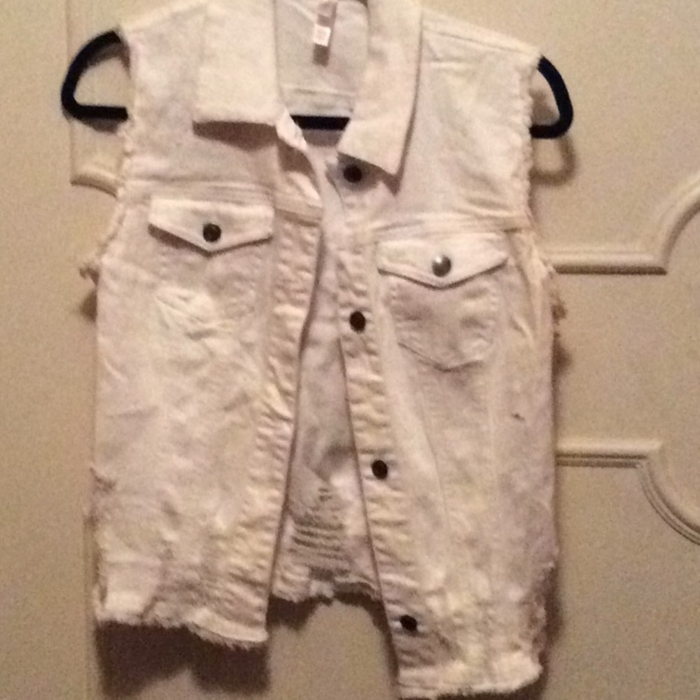 Distressed white denim vest.